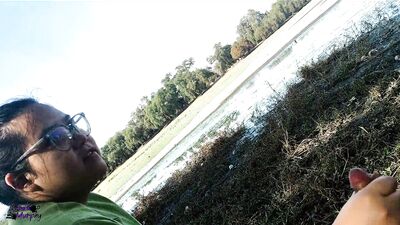 Public cumshot on the side of the lake