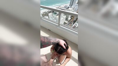 Hot slut sucks big dick on balcony in Miami