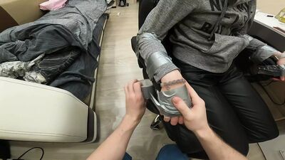Silver tape tied to chair, leather pants, sock gagged