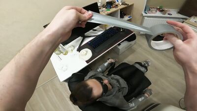 Silver tape tied to chair, leather pants, sock gagged