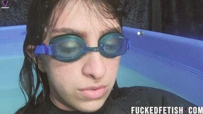 Watch Mia Closeup's submissive girl in black skinny neoprene swimsuit get drenched in the pool