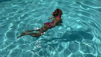 Monika Fox Poses In Pink Bikini And Swims In Pool Surrounded By Skyscrapers
