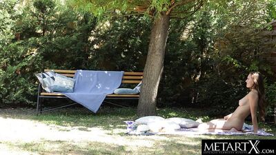 Beauty's big natural tits bounce as she masturbates outdoors