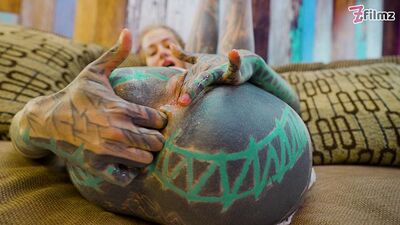 High-Heeled Tattooed Vixen Rubs One Out in Sheer White Lingerie