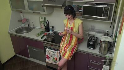 Petite short-haired housewife in high heels rubs her hairy cunt on the kitchen counter
