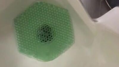 Almost Caught in action at the urinal Pinching off/on Janitor saw wet floor