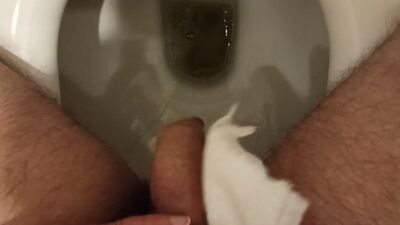 Pee. He wiped the urine drops with a napkin. He rolled off the wet shiny head. I dream that my wife