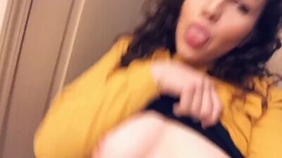 Cute curly haired teen plays with her tits