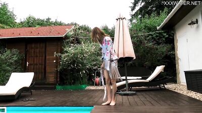 Watch Hermione Ganger, the petite Hungarian teen, get naked in the pool & get drenched