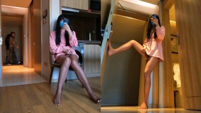 Chinese ladyboy in pink dress opens hotel room door and cums on stockings