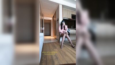 Chinese ladyboy in pink dress opens hotel room door and cums on stockings