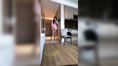 Chinese ladyboy in pink dress opens hotel room door and cums on stockings