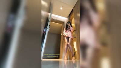 Chinese ladyboy in pink dress opens hotel room door and cums on stockings